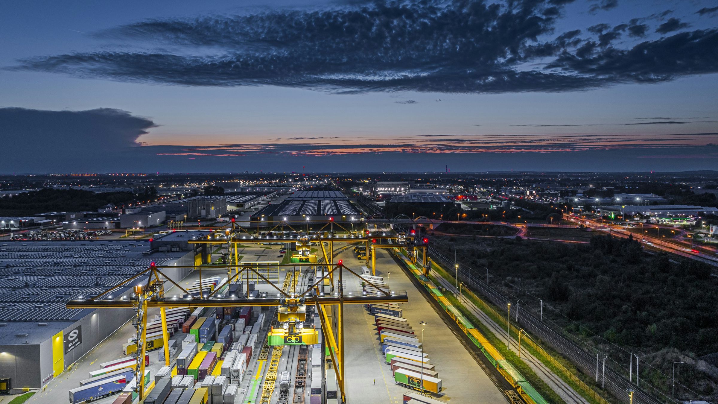 Container terminal and gantry cranes at dusk